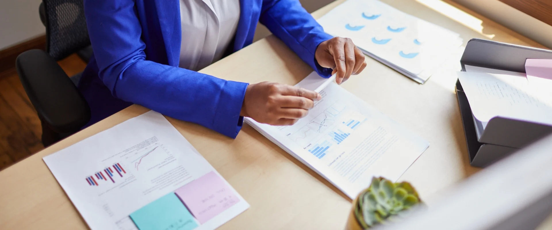 Person at a desk looking at reports