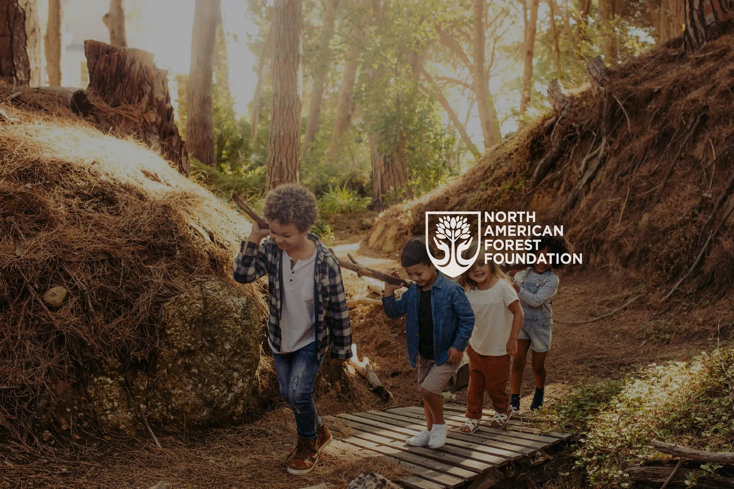 NAFF logo with kids walking in the woods.