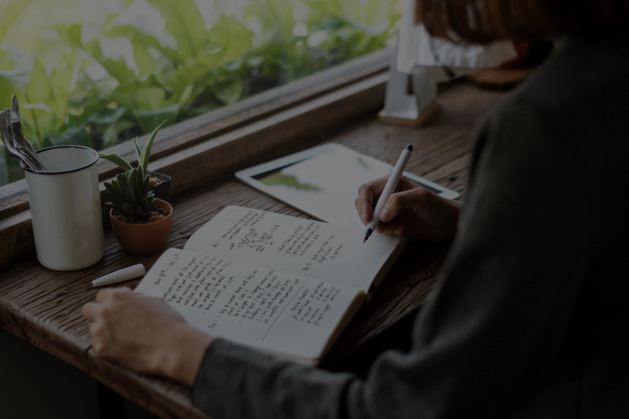 Woman writing in a journal