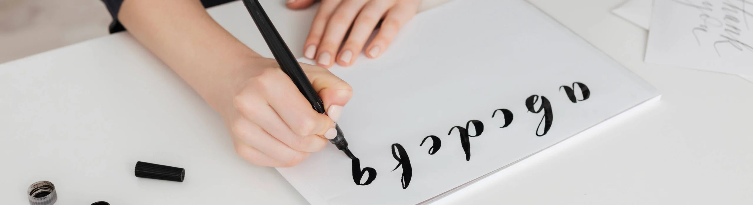 Person practicing calligraphy