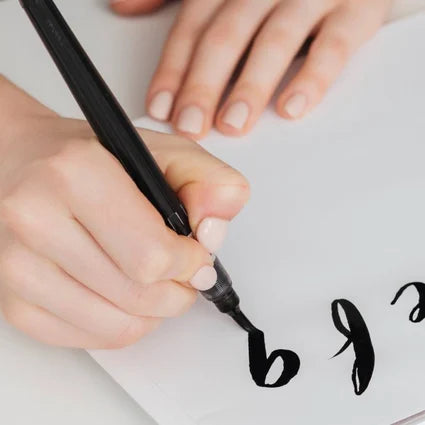 Closeup of a someone practicing calligraphy