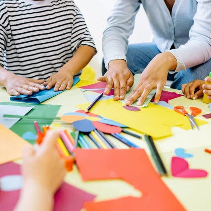 Students and teacher doing making crafts