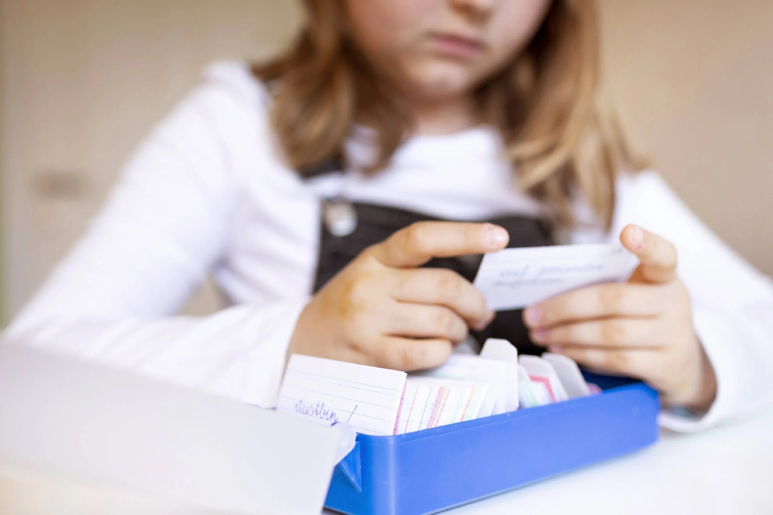 Child looking at flashcards