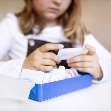 Child looking at flashcards