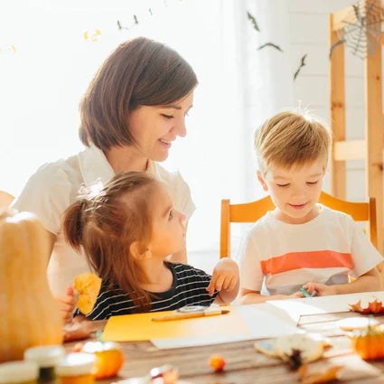Mom and kids making halloween cards