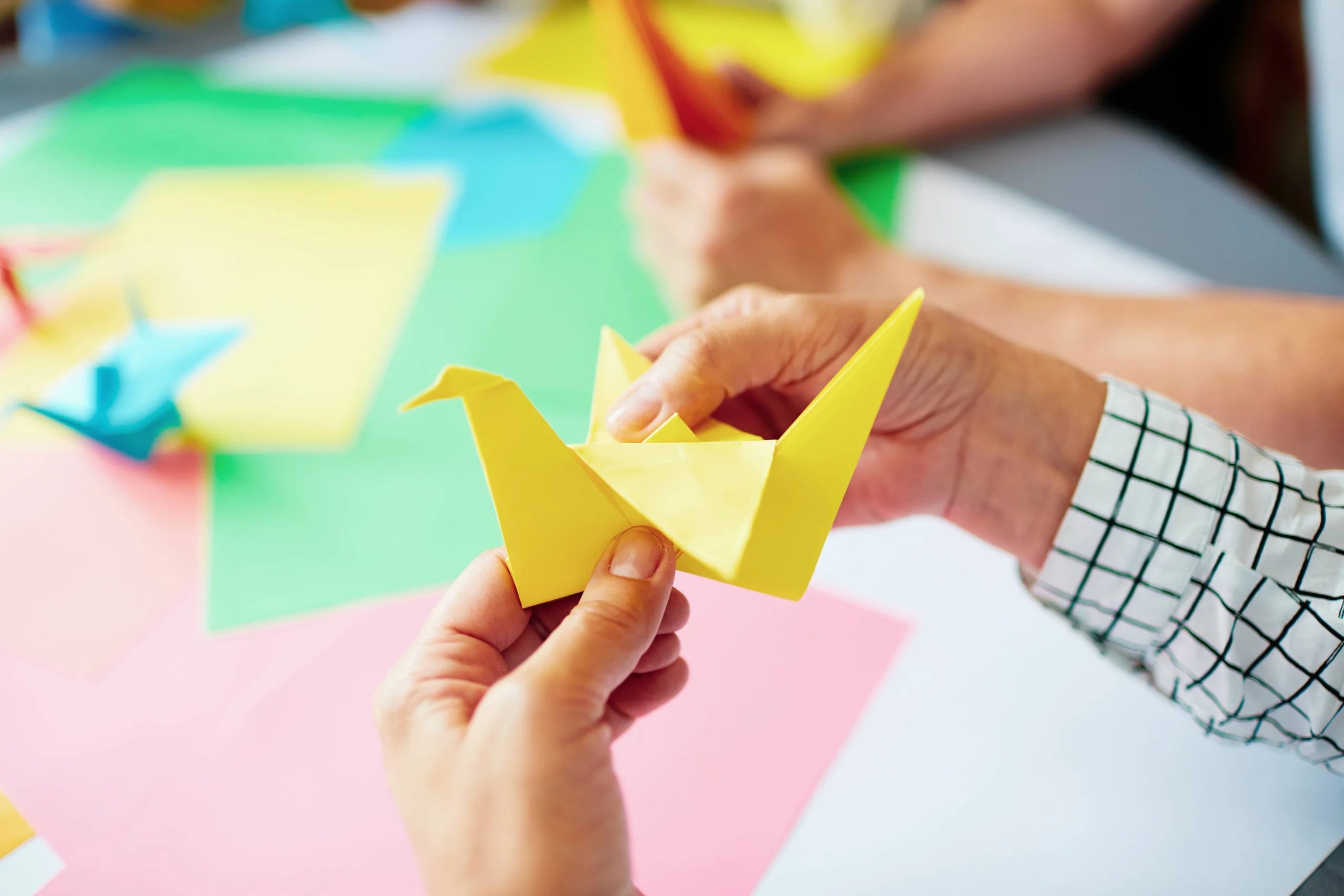 Closeup of a yellow origami swan