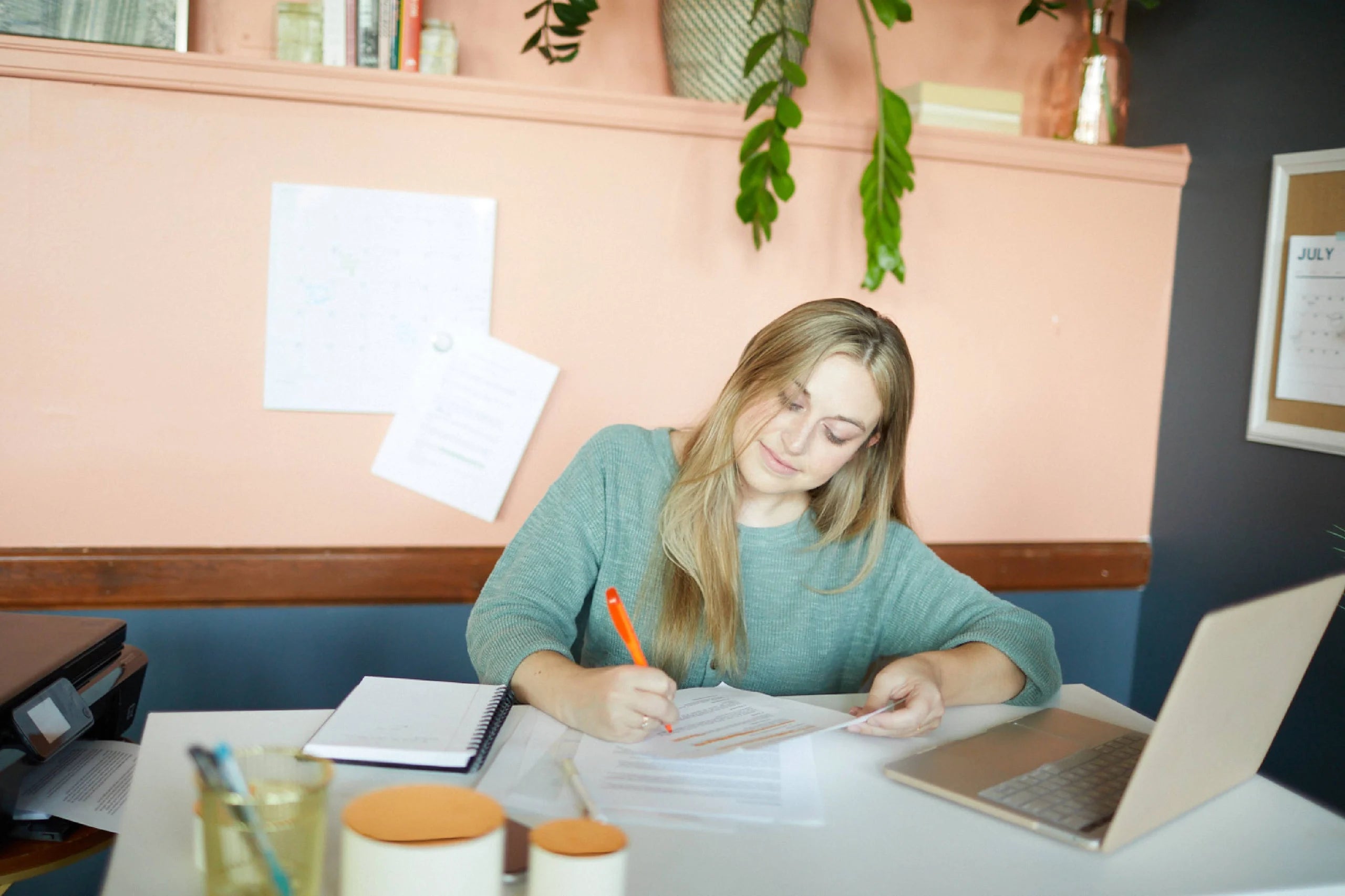 Woman writing and editing a press release