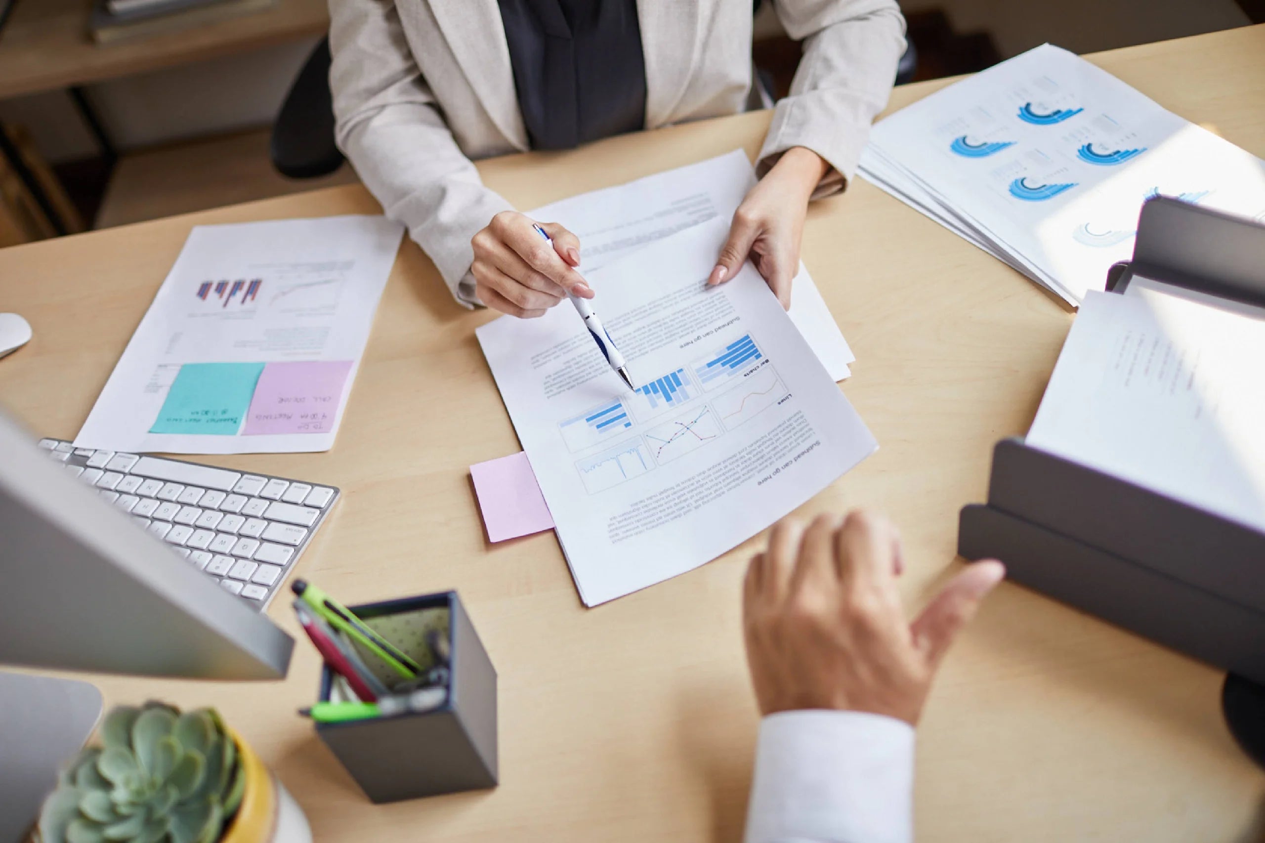Two people looking at a business proposal